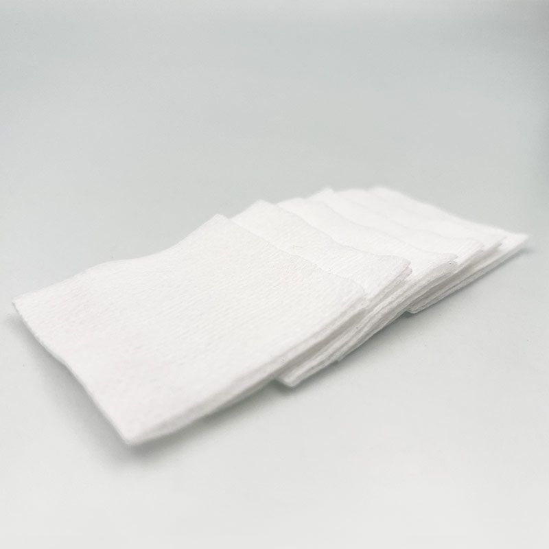 Non-woven compresses